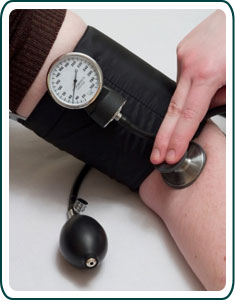 A person having their blood pressure checked.