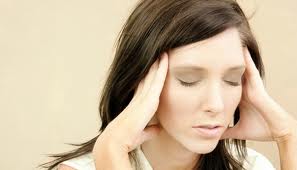 Woman suffering from a frequent headache condition
