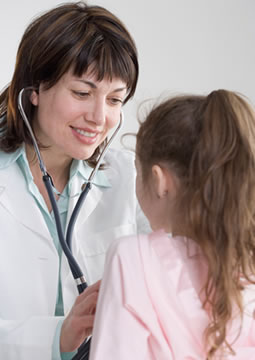 Doctor examining girl for symptoms of meningitis